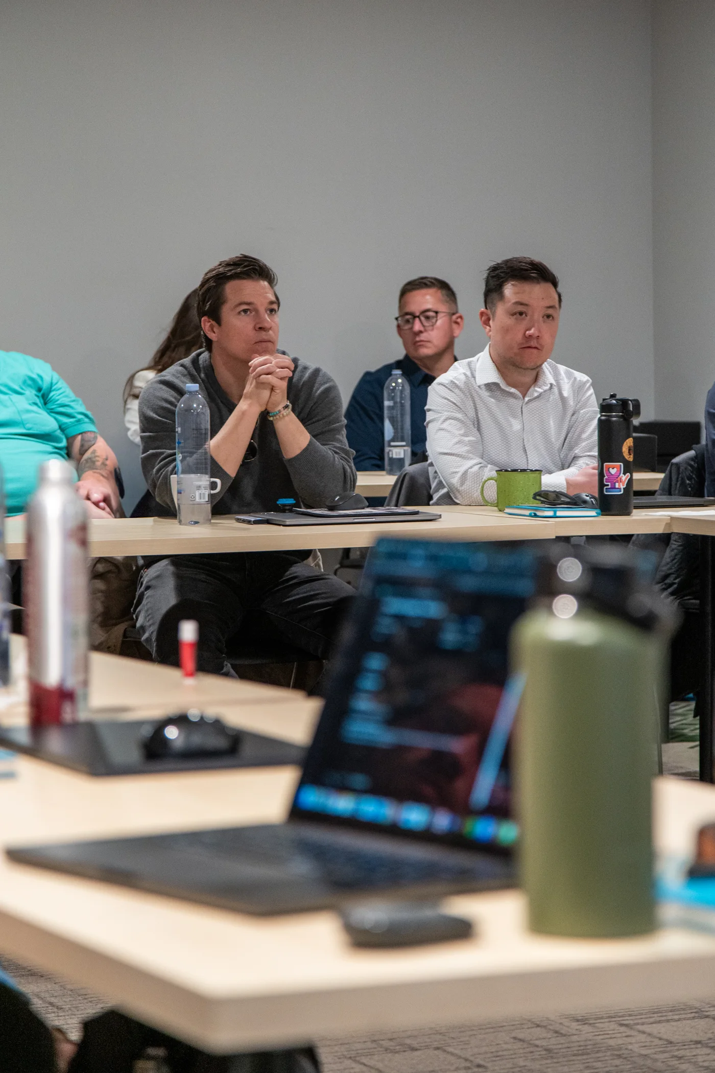 Juris Digital colleagues listening during a summit session